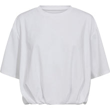 Load image into Gallery viewer, The Baily Balloon T-shirt in white is your crisp take on casual. Cut from soft cotton with an oversized silhouette and gathered balloon hem, it’s the perfect piece for playful styling.
Tuck it into denim or layer over tailoring for instant volume and edge.
Size &amp; Fit:
• Oversized fit
• Dropped shoulders
• Gathered elastic hem
Details:
• Crisp white cotton
• Clean crew neckline
• Soft and structured feel