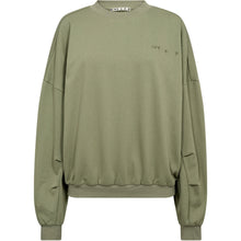 Load image into Gallery viewer, The Elly Oversized Sweat is designed with a relaxed silhouette and voluminous sleeves for an effortless off-duty feel. Crafted in soft sweatshirt fabric with ribbed trims.
The oversized fit and subtle embroidered logo make it an easy everyday staple
Size &amp; Fit
• Oversized fit
• Relaxed silhouette
• Voluminous sleeves
• Ribbed hem and cuffs
Details
• Soft sweatshirt quality
• Crew neckline
• Embroidered IVY CPH logo
• Ribbed trims
• Dropped shoulders