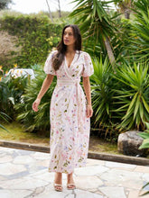 Load image into Gallery viewer, Beautiful long dress with short sleeves, floral print, and a tie at the waist. The model is 176 cm tall and wears size 36