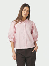 Load image into Gallery viewer, A shirt blouse with short balloon sleeves with an elastic cuff, that is adjustable with buttons. The shirt has a flip collar and buttons down the front. The shirt has a boxy fit. The model is wearing size 36.