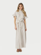 Load image into Gallery viewer, Short sleeved dress in cotton poplin with stripes. It has pockets in the side seam, ruffle details at the sleeves and collar, and buttons down the front. The waist has smock at the back, and tie band. The model is 176 cm and wearing size 36.