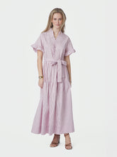 Load image into Gallery viewer, Short sleeved dress in cotton with stripes. It has pockets in the side seam, ruffle details at the sleeves and collar, and buttons down the front. The waist has smock at the back, and tie band. The model is 174 cm and wearing size 36.