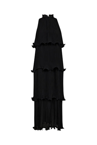 pleated tiers, this sleeveless maxi dress creates graceful movement with every step.
The high neckline is softly gathered with delicate ruffle detailing, adding a touch of romantic contrast to the architectural silhouette.
Ideal for evening occasions or elevated daytime dressing, it’s a standout piece with effortless allure.
Size & Fit
• Relaxed, flowy fit
• Full-length silhouette
• High ruffled neckline
Details
• Tiered pleated design
• Button closure at neck
• Sleeveless construction
• Lightweight fab