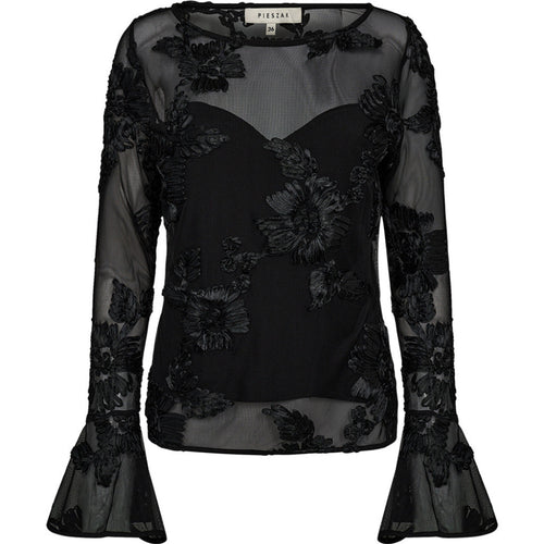 The Melia Flounce Sleeve Mesh Blouse brings a romantic edge to evening dressing. Crafted from sheer mesh with intricate tonal embroidery, the silhouette is soft and structured with a fitted inner bodice and subtle bell sleeves.
A statement piece that balances delicacy and drama - perfect for elevating tailored trousers or denim with ease.
Size & Fit
• Fitted inner bodice
• Semi-sheer sleeves and back
• Hip length
Details
• Embroidered mesh overlay
• Bell sleeves
• Lightweight and lined through the body