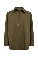 Load image into Gallery viewer, A crisp essential with an easy silhouette. Nyla blends classic shirting with modern volume – think sharp collar, soft shoulders, and oversized cuffs. Side button details let you shape the look to suit your mood.

Details
• Classic collar with open neckline.
• Oversized cuffs with button closure.
• Adjustable side button detail.
• Curved hem and back pleat.
• Made in crisp cotton poplin..

Size &amp; Fit
• Relaxed fit.
• Dropped shoulders.
• Curved hem.