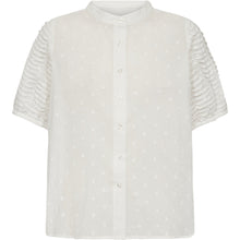 Load image into Gallery viewer, A feminine classic with an elevated twist. The Cala shirt is crafted from airy cotton with a subtle dotted texture, detailed with pintuck pleats along the short sleeves for a soft sculptural effect.
Size &amp; Fit
• Relaxed fit
• Hip length
• Short sleeves
Details
• Pintuck detailing on sleeves
• Button front closure
• Lightweight textured cotton
