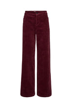 Load image into Gallery viewer, Gilly Jeans in soft corduroy offer a modern take on retro cool. Cut in a flattering high-waist silhouette with wide legs, they blend comfort with effortless style.
The plush texture adds depth and a seasonal touch, making them an elegant alternative to denim.
Size &amp; Fit
• High waist
• Wide-leg fit
• Full length
• True to size
Details
• Wide-leg corduroy jeans
• Soft cotton blend
• Zip and button closure
• Belt loops and five-pocket design