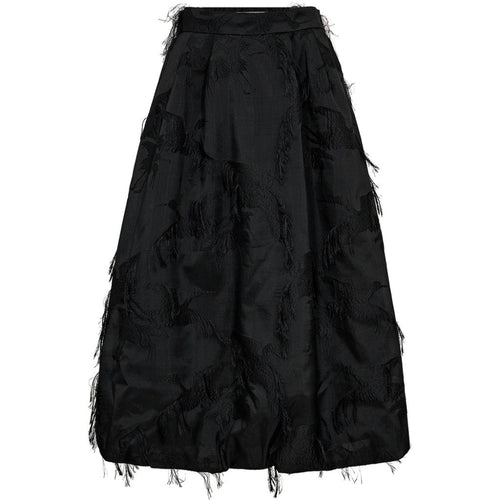 The Winnie Balloon Flamingo Skirt brings sculptural volume and rich texture to evening dressing. Cut from a structured jacquard with fringed flamingo motifs, this voluminous A-line silhouette floats away from the body for a dramatic, ballooned effect.
An elegant choice for event dressing, it pairs effortlessly with a tucked-in blouse or a fitted knit for a modern contrast.