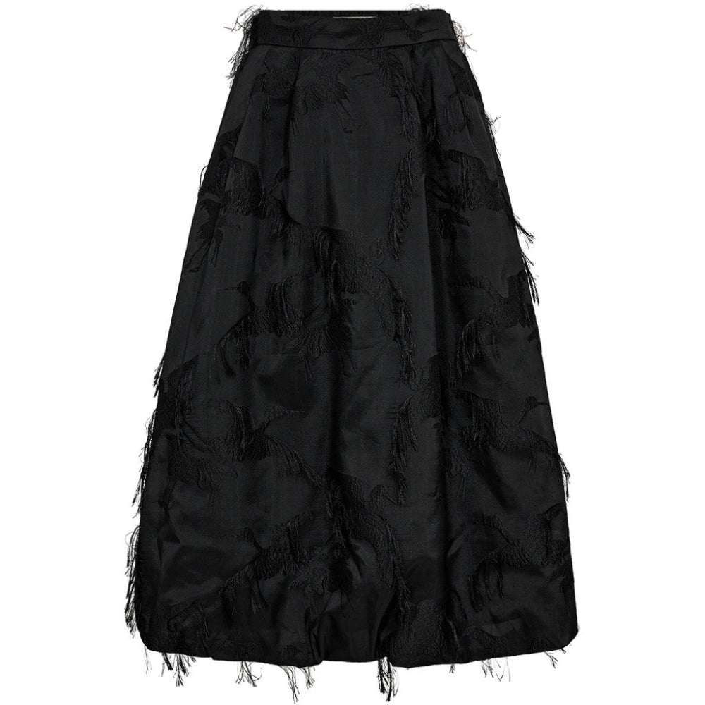 The Winnie Balloon Flamingo Skirt brings sculptural volume and rich texture to evening dressing. Cut from a structured jacquard with fringed flamingo motifs, this voluminous A-line silhouette floats away from the body for a dramatic, ballooned effect.
An elegant choice for event dressing, it pairs effortlessly with a tucked-in blouse or a fitted knit for a modern contrast.