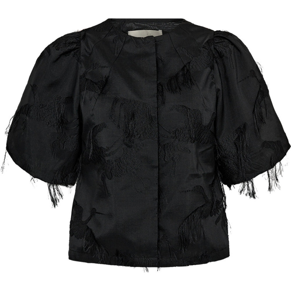 The Winnie Puffy Flamingo Jacket is a bold expression of texture and form. Crafted from a sculptural jacquard with fringed flamingo motifs, this cropped jacket is designed with voluminous sleeves and a clean, minimal neckline.
Its soft puff shape adds a sculptural contrast to tailored pieces or a matching skirt for a standout evening look.
Size & Fit
• Boxy, slightly cropped silhouette
• Voluminous short sleeves
• True to size