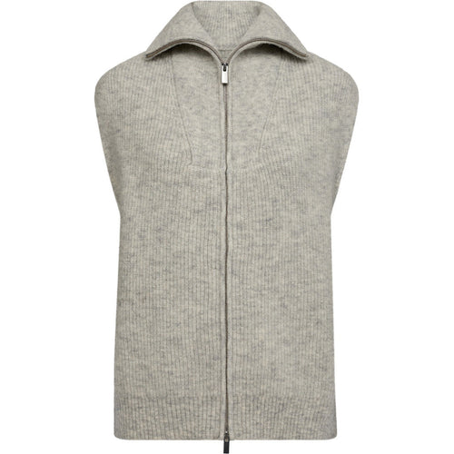 a modern layering piece crafted in a wool blend for a soft, slightly brushed finish. The sleeveless silhouette is detailed with a two-way zip and tall ribbed collar, giving it a clean yet casual look that pairs effortlessly over shirts or knits.
Details
• Sleeveless knitted vest.
• Two-way front zipper.
• High collar.
• Soft and brushed wool blend.
• Ribbed hem and collar.