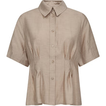 Load image into Gallery viewer, The Viola Peplum Shirt is a tailored take on everyday shirting, designed with subtle pleats that create a softly defined waist and peplum-like silhouette. Crafted from a light melange fabric with a clean button-down front and short sleeves.
Size &amp; Fit
• Slightly tailored fit with soft peplum.
• Button-down front.
• Short sleeves.
• True to size.
Details
• Lightweight melange fabric.
• Pleated detailing at waist.
• Classic shirt collar.
