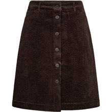 Load image into Gallery viewer, The Gilly Skirt offers a modern take on retro-inspired tailoring. Cut from soft corduroy with a structured yet comfortable feel, this A-line silhouette is designed to sit high on the waist and finishes just above the knee.
The full button-through front and clean waistband bring a crisp, minimal finish
Size &amp; Fit
• High-rise waist
• A-line silhouette
• Above-knee length
Details
• Button-through front
• Belt loops
• Side pockets
• Soft corduroy with subtle stretch