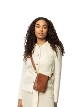Load image into Gallery viewer, Meet Fillis Small – compact, chic, and ready for any occasion! Crafted from 100% leather, this small crossover is a fashion essential. Unzip to reveal a well-organized main compartment with a small zip pocket inside. It's handcrafted with attention to detail and features an adjustable and detachable strap for your on-the-go adventures.

• Handcrafted
• Adjustable and detachable strap
• Compact and versatile

