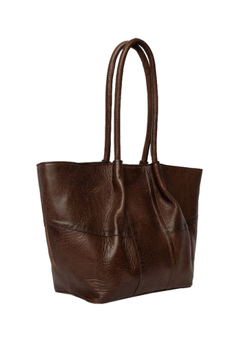 The Mane Small is a stylish shoulder bag designed with elegance and practicality in mind. It features comfortable shoulder straps and a beautiful ruched design running down the front, adding a soft and luxurious touch to its look. The bag has a structured base, allowing it to stand upright on its own. Inside, you'll find a spacious main compartment with plenty of room for your everyday essentials — perfect for life on the go.