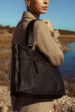 Load image into Gallery viewer, Timelessly designed large leather bag with zip top closure, shoulder handle, and adjustable/removable long strap. The leather gains a beautiful patina over time, showcasing a unique character. Accommodates a 15&quot; laptop.