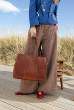 Load image into Gallery viewer, Nellie Big is a stylish and versatile workbag in a timeless design. The perfect everyday bag.
• Handcrafted
• Back zip pocket
• Two zippered main compartments
• Adjustable, removable crossover strap
Made in our Grain Leather Quality - a naturally grained cow leather that is drum-dyed to preserve the original texture and supple feel. Each piece is cut by hand and polished with wax, to achieve a distinctive and soft finish. 