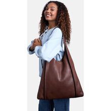 Load image into Gallery viewer, Siv Big is an elegant shoulder bag in a timeless design.
• Handcrafted
• Button closure
• Spacious main compartment with two open pockets and one zippered pocket in the middle.
This bag is made from our Florence Leather Quality – a fully naked, drum dyed, dry milled leather. Its high quality is ideal for unlined bags, where the beautiful raw interior becomes an intentional part of the design. The leather is soft yet highly durable, offering a refined, premium feel. The Florence Leather Quality showcases the