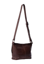 Load image into Gallery viewer, Svea Small is an elegant crossover in a timeless design.
• Handcrafted
• One zip pocket on the side of the bag
• Metal zipper closure
• Adjustable crossover strap
• Spacious main compartment with one zippered pocket and two open pockets inside
This bag is made from our Urban Leather Quality - a milled cow leather that is dyed
before the surface is finalized. This process preserves the leather’s natural texture, leaving each bag with unique characteristics, where no two are the same. 