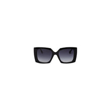 Load image into Gallery viewer, Oversized, glam sunglasses with a sharp graphic expression and an elegant, contemporary look for women. Metal rods with brass coating and tinted glass.
• One size
• Metal eyeglass rods
• Tinted glasses
• 100% recycled polycarbonate
• Delivered in a small organic cotton bag