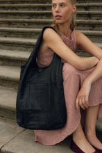 Load image into Gallery viewer, Classic tote in lightweight full grain leather. Fits all daily needs, with a slip pocket, unlined for a natural look, and room for a 15" laptop.

• Handcrafted
• Inside zipper pocket
• Dirt and liquid repellent

Made in Urban Leather
A natural milled cow leather defined by its unique features where the original grain pattern has been preserved. A light wax has been applied to enhance the vintage look of the leather leaving it smooth &amp; soft.