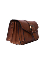 Load image into Gallery viewer, The Neko bag is a sleek crossover bag featuring a beautiful buckle-detail closure. It offers excellent organization with a total of four open compartments and two zippered sections, making it easy to keep your essentials neatly arranged.
Made in our Urban leather quality - a natural milled cow leather, where each bag is processed and dyed before the surface has been finalized, which keeps the original grain pattern of the raw leather. After the bags have been dyed, light wax is applied by hand, leaving a sm