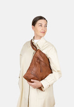 Load image into Gallery viewer, Storslet Urban is a soft crossover bag with one front pocket which closes with a metal zip. The main compartment closes with a metal zip and has a small zip pocket in the lining and two open pockets suitable for your phone and keys. It has an adjustable crossover strap.