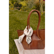 Load image into Gallery viewer, The Mane Small is a stylish shoulder bag designed with elegance and practicality in mind. It features comfortable shoulder straps and a beautiful ruched design running down the front, adding a soft and luxurious touch to its look. The bag has a structured base, allowing it to stand upright on its own. Inside, you'll find a spacious main compartment with plenty of room for your everyday essentials — perfect for life on the go.